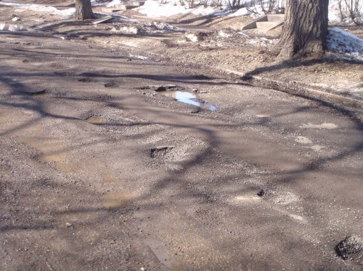 The cyclists foe changes from ice to potholes.